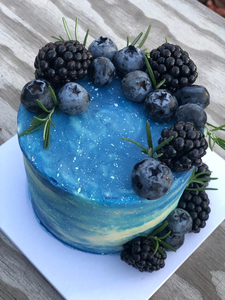 fresh berries on buttercream cake